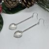 Heart dangle earrings on white background