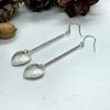 Heart dangle earrings on white background