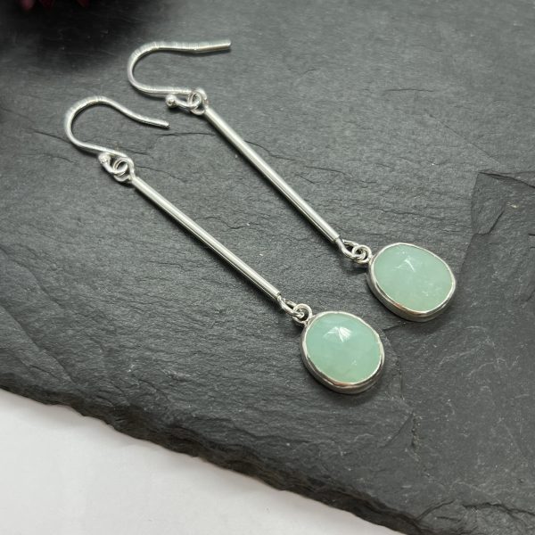 Amazonite drop earrings on grey tile