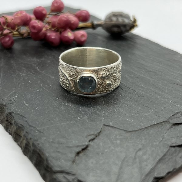 LorriSilverJewellery, moss aquamarine wide band ring on grey tile