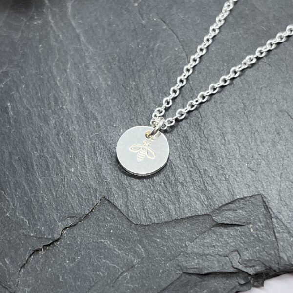 Manchester bee necklace on a grey background, lorrisilver Jewellery